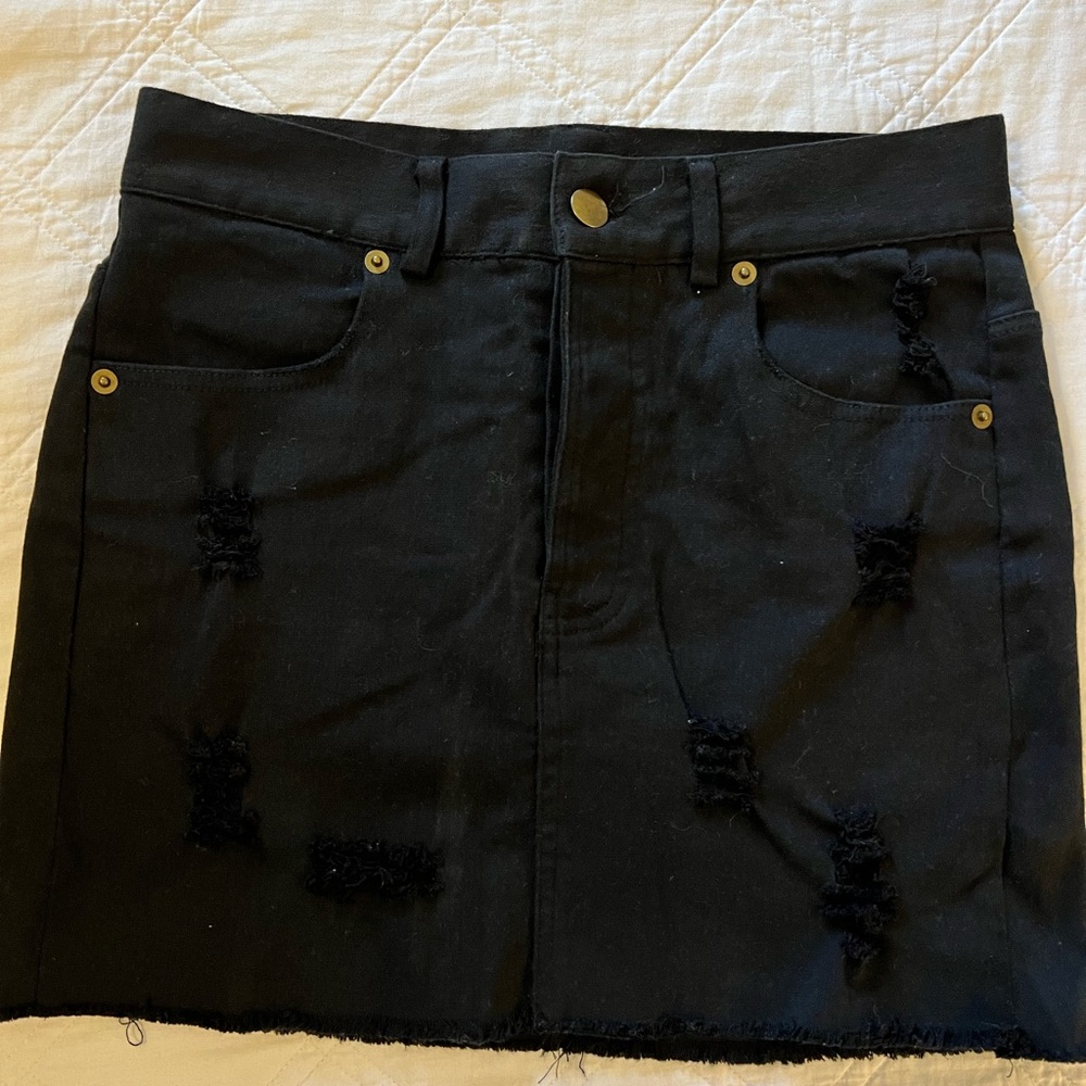 Distressed denim mini skirt